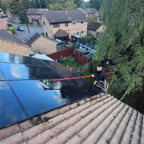 Kyle cleaning solar panels